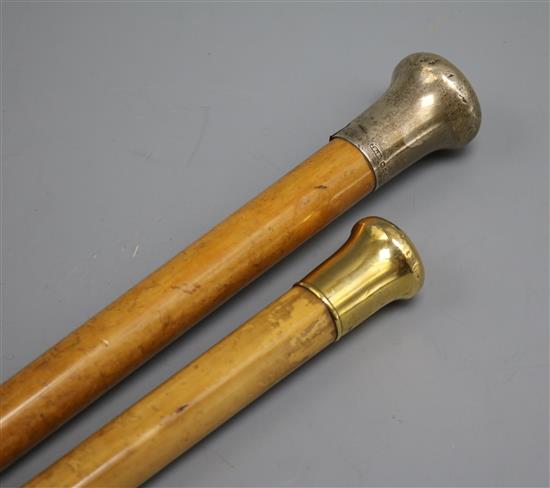 An 18ct gold topped walking stick and a silver topped walking stick
